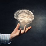 illustration of brain with a hand underneath holding it up