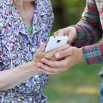 Two people holding a phone