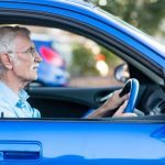 Senior man behind the wheel