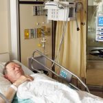 Senior man in hospital bed