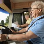 Senior woman driving RV.