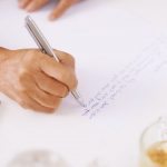 A senior writing a letter