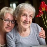 Happy grandmother with her adult daughter