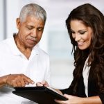 Female agent with senior client