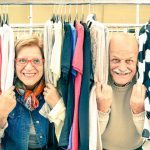 Playful senior couple at weakly flea market - Happy elderly