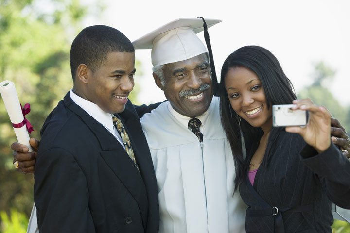 Grandpa at graduation with grandkids