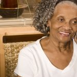 Mature Woman indoors using the phone
