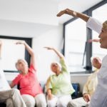 Seniors exercising in chairs