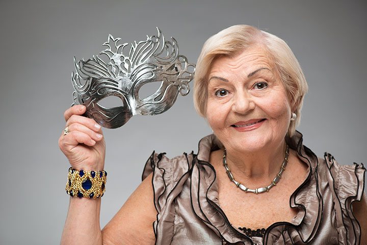 Elderly woman wearing glamorous mask