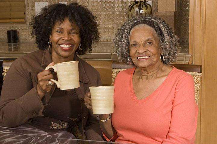 Mother and daughter having coffee