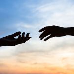 Two hands touching