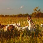 Little girl with goats