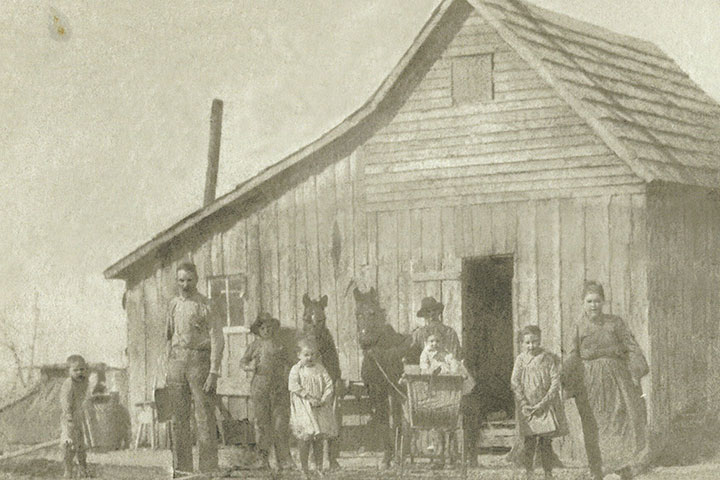 The other photo is of their homestead in Indian Territory in the early 1900's. You can see her to the far right.
