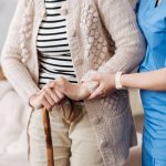 Nurse helps aging person