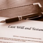 Last will and testament document with brown pen on desk