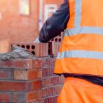 Bricklayer building a wall.